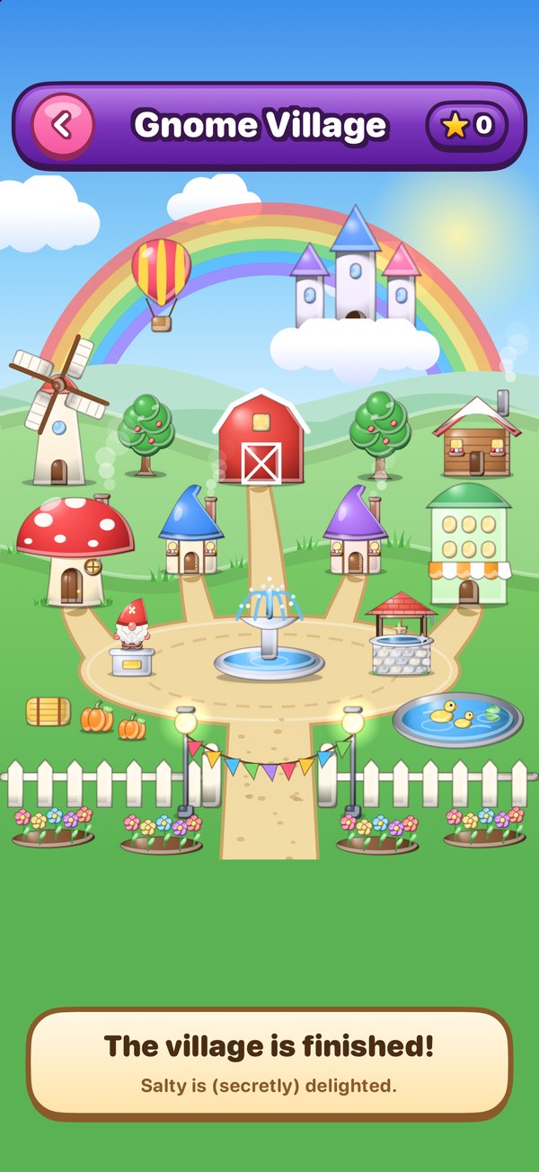 The finished Gnome Village with cottages, a windmill, fountain, pond and a rainbow
